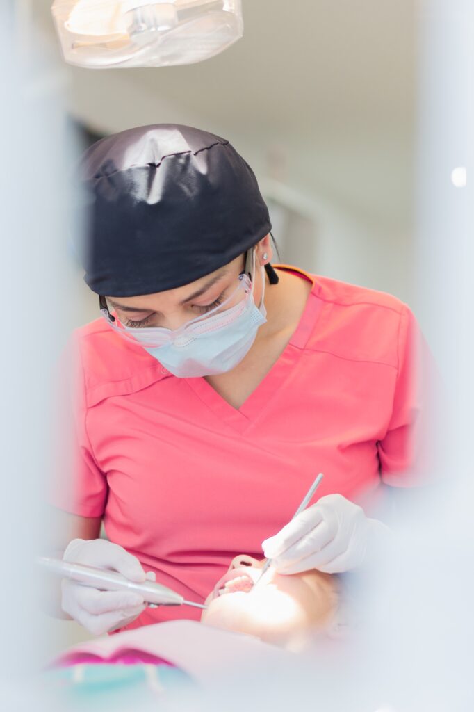 Girl in a dental office, receiving dental treatment.